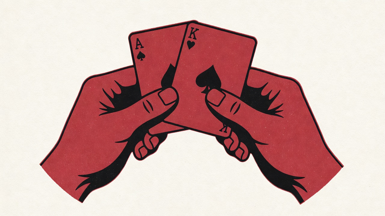two premium playing cards held firmly in a player's hands showing controlled grip technique