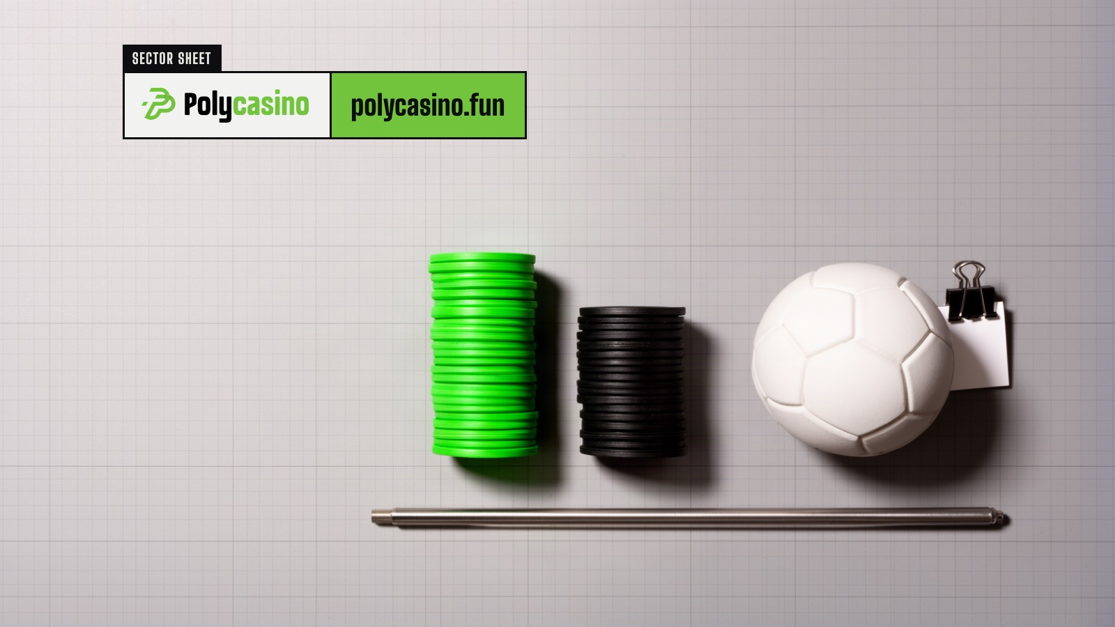 Overhead flat lay of a tall green and a short black token stack beside a football on grid paper.